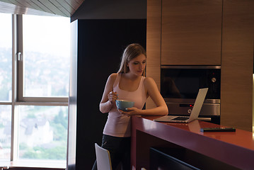 Image showing woman eating breakfast enjoying relaxing lifestyle