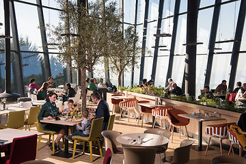 Image showing Young parents enjoying lunch time with their children