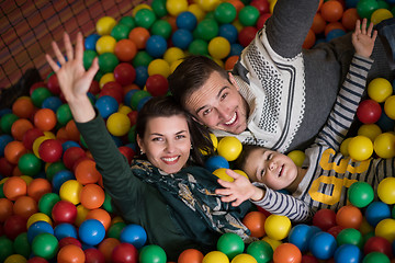 Image showing young parents with kids in a children\'s playroom