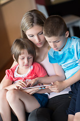 Image showing Young Family Using A Tablet To Make Future Plans