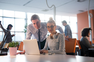 Image showing Two Business People Working With laptop in office