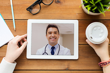 Image showing patient having video call with doctor on tablet pc