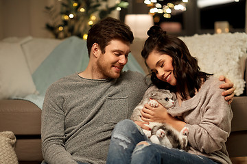 Image showing happy couple with cat at home