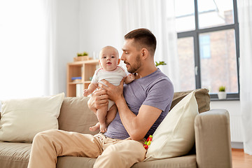 Image showing father with little baby girl at home