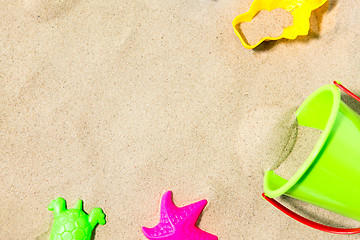 Image showing close up of sand toys kit on summer beach