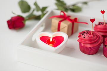 Image showing close up of candle and cupcakes for valentines day