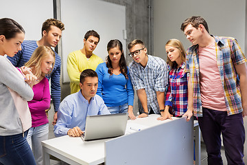 Image showing students and teacher with laptop at school