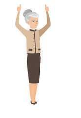 Image showing Senior business woman standing with raised arms up