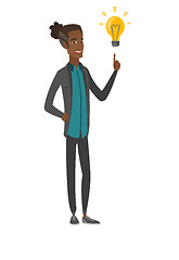 Image showing African businessman pointing at idea lightbulb.