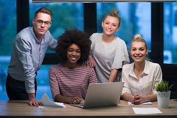 Image showing Multiethnic startup business team in night office