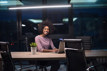 Image showing black businesswoman using a laptop in startup office