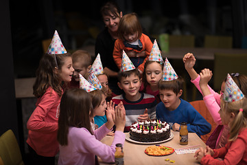 Image showing The young boy joyfully celebrating his birthday