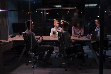 Image showing Multiethnic startup business team in night office