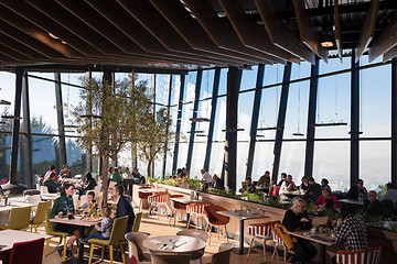 Image showing Young parents enjoying lunch time with their children