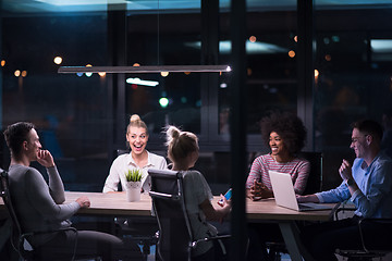 Image showing Multiethnic startup business team in night office