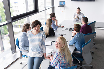 Image showing Pretty Businesswomen Using Tablet In Office Building during conf