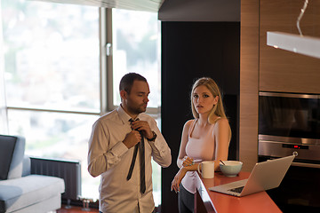 Image showing A young couple is preparing for a job and using a laptop