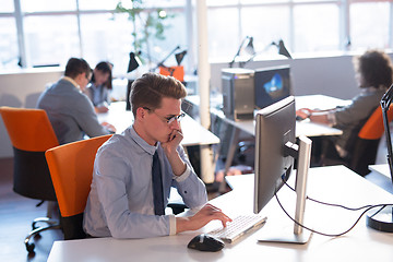 Image showing businessman working using a computer in startup office