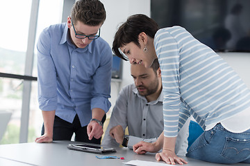 Image showing group of Business People Working With Tablet in startup office