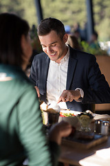 Image showing Closeup shot of young woman and man having meal.