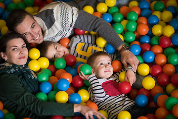 Image showing young parents with kids in a children\'s playroom