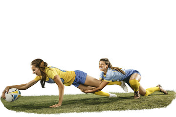 Image showing The young female rugby players isolated on white backround