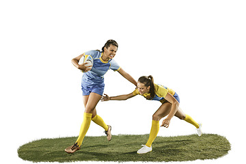 Image showing The young female rugby players isolated on white backround