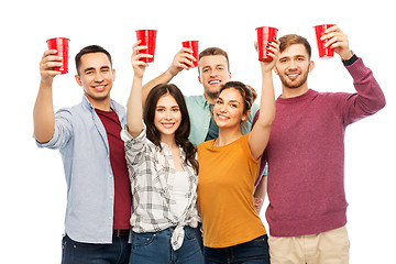 Image showing group of smiling friends with drinks in party cups