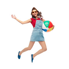 Image showing teenage girl in sunglasses jumping with beach ball