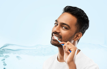 Image showing indian man with toothbrush cleaning teeth