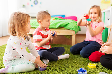 Image showing children with modelling clay or slimes at home