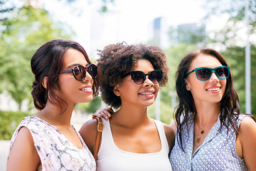 Image showing happy young women in sunglasses at summer park