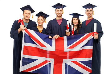 Image showing graduate students with diplomas and british flag