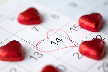 Image showing close up of calendar and heart shaped candies