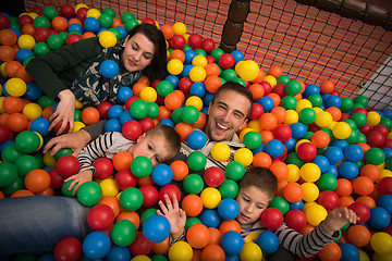 Image showing young parents with kids in a children\'s playroom