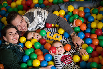 Image showing young parents with kids in a children\'s playroom