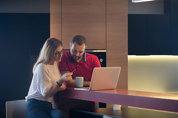 Image showing happy young couple buying online