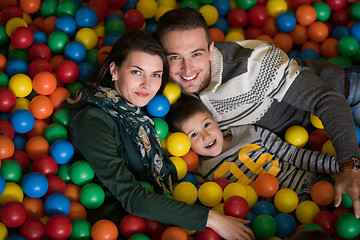 Image showing young parents with kids in a children\'s playroom