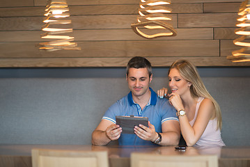 Image showing couple using tablet at home