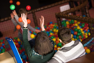 Image showing young parents with kids in a children\'s playroom