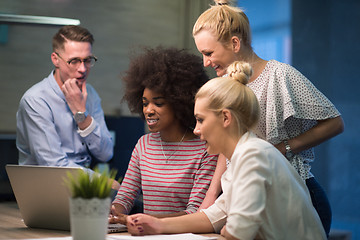 Image showing Multiethnic startup business team in night office