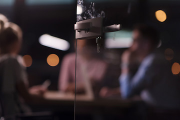 Image showing Multiethnic startup business team in night office