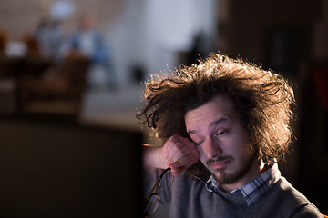 Image showing man working on computer in dark office