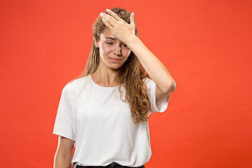 Image showing Woman having headache. Isolated over pastel background.