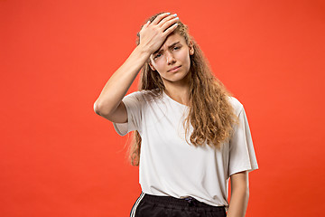 Image showing Woman having headache. Isolated over pastel background.