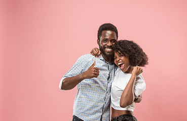 Image showing Winning success woman happy ecstatic celebrating being a winner. Dynamic energetic image of female afro model