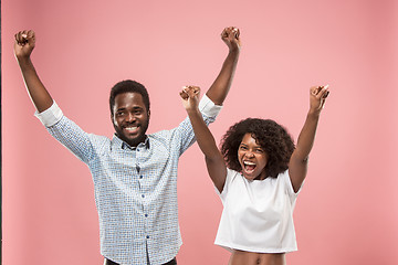 Image showing Winning success woman happy ecstatic celebrating being a winner. Dynamic energetic image of female afro model