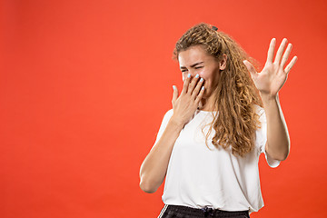 Image showing Let me think. Doubtful pensive woman with thoughtful expression making choice against pink background