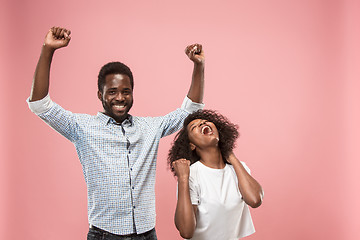 Image showing Winning success woman happy ecstatic celebrating being a winner. Dynamic energetic image of female afro model