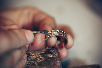 Image showing Different goldsmiths tools on the jewelry workplace. Jeweler at work in jewelry.